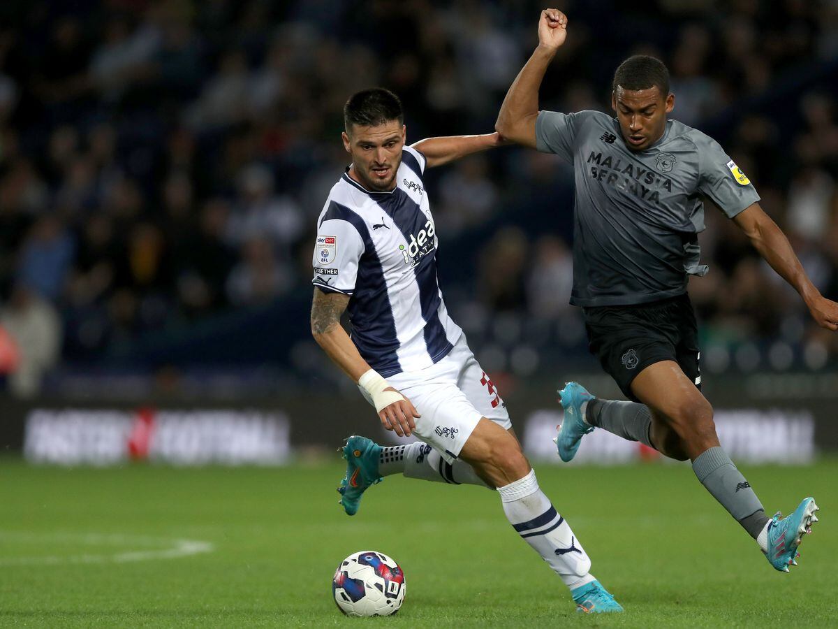 Okay Yokuslu of West Bromwich Albion and Andy Rinomhota Cardiff City during the Sky Bet Championship between West Bromwich Albion and Cardiff City at The Hawthorns on August 17, 2022 in West Bromwich, United Kingdom. (Photo by Adam Fradgley/West Bromwich Albion FC via Getty Images).