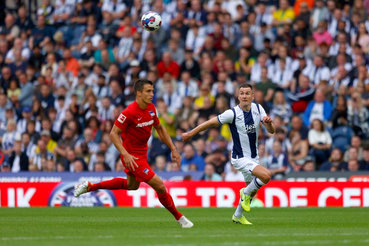 Jed Wallace of West Bromwich Albion competes with Marc Kempf of Hertha Berlin during the Pre-Season Friendly between West Bromwich Albion and Hertha Berlin at The Hawthorns on July 23, 2022 in West Bromwich, England. (Photo by Malcolm Couzens - WBA/West Bromwich Albion FC via Getty Images).