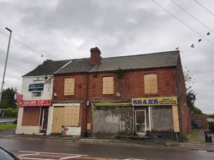 Front view of the four derelict shops