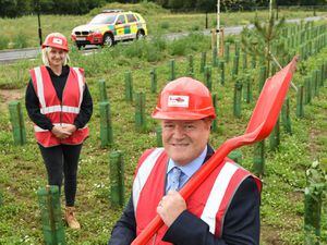 Pam Hodgetts, corporate partnerships manager for Midlands Air Ambulance Charity and Neal Hooper, managing director of Aico Ltd explore the grounds of the new airbase and headquarters facility