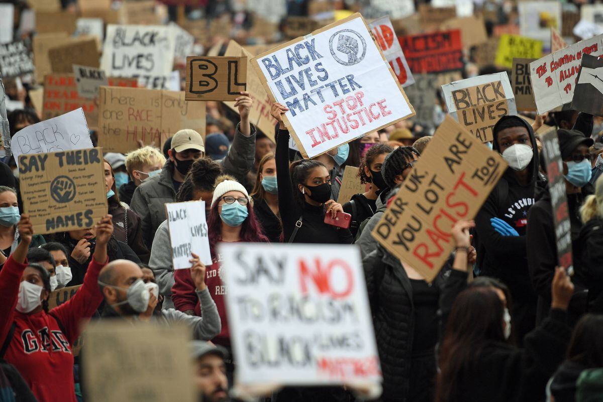 People gather during a Black Lives Matter protest rally at Centenary Square in Birmingham,