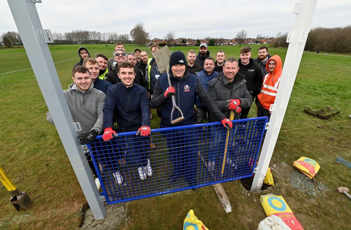 Andy Paddock and friends with the new goalposts at Coppice Farm Park and Fields, in Willenhall, in memory of Farley Kidner