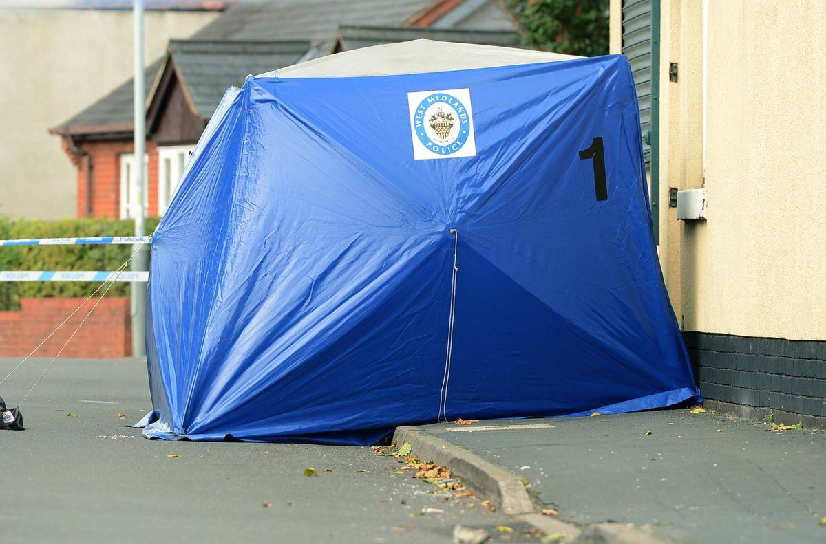 A blue forensic tent in Queen Street, opposite Bilston Town FC's ground