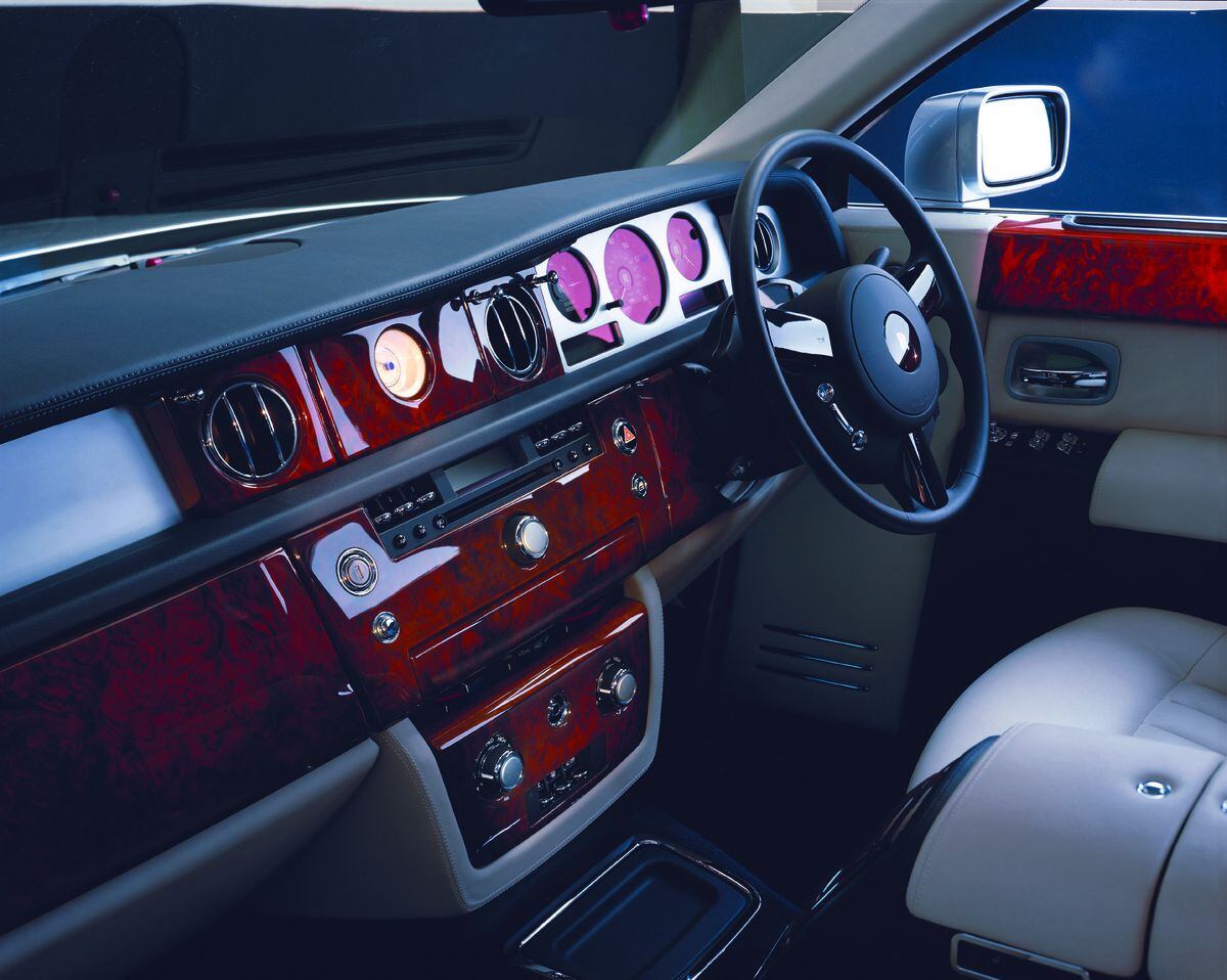This is interior of the all-new Rolls-Royce Phantom that is being unveiled Friday January 3, 2003 at the company's new manufacturing plant and head office at Goodwood in West Sussex, UK. The car has a V12 engine taking it from 0-60 mph in 5.7 seconds (0-100 kph 5.9 seconds) and on to a limited top speed of 149 mph (240 kph). Elsewhere the electrically retractable Spirit of Ecstasy can be lowered out of sight whenever the Phantom is parked; the wheel hub centres, bearing the interlinked double-R logo, remain upright; and there are umbrellas stowed within each rear door. It is just four and a half years since BMW Group became the custodians of the Rolls-Royce marque for automotive use, in July 1998, and committed to launch a new company, a new plant and a new motor car in January 2003. The car goes on sale from today at  208,000 (320,000 Euros) excluding Tax.  See Pa story TRANSPORT.  PA Photo: Rolls Royce Handout.