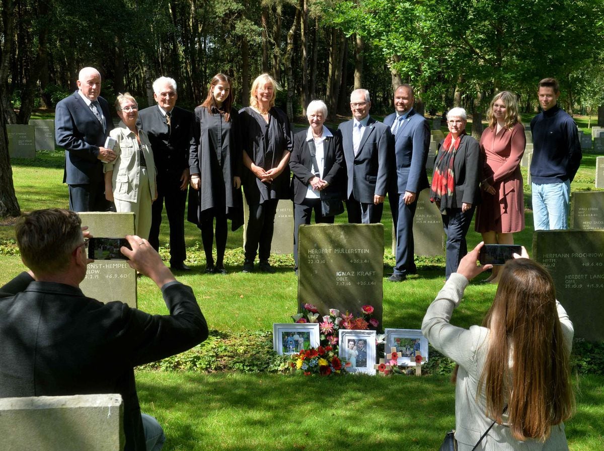 Family and friends of Ignaz Kraft visit his grave