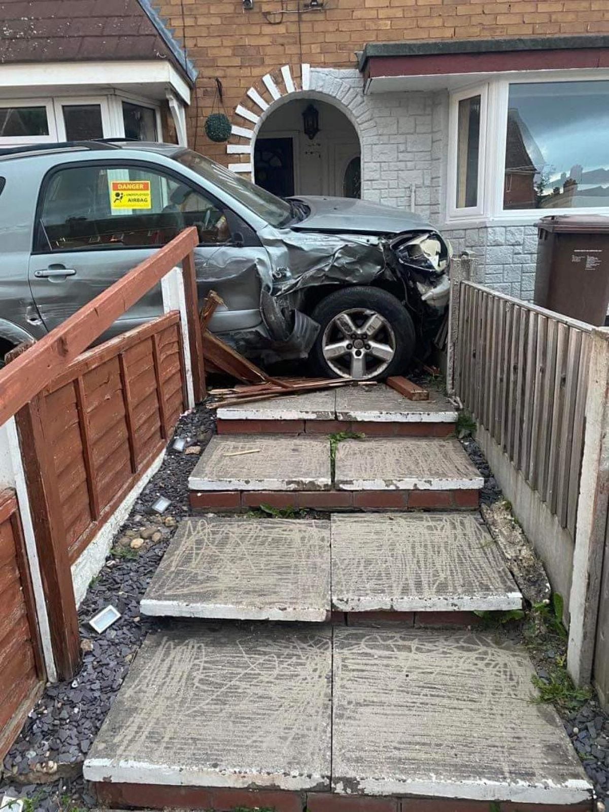 A car crashed into a house on Lister Road, Beechdale, Walsall on June 9. Photo: Trevor Bailey