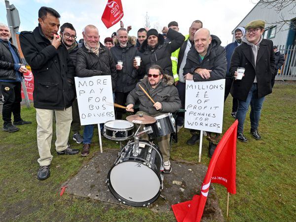 Drumming up support - Mark Crump entertains the strikers at Pensnett Trading Estate, Kingswinford