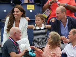 The Duke and Duchess of Cambridge with Princess Charlotte seated behind the Earl and Countess of Wessex at the University of Birmingham Hockey and Squash Centre on day five of the 2022 Commonwealth Games in Birmingham