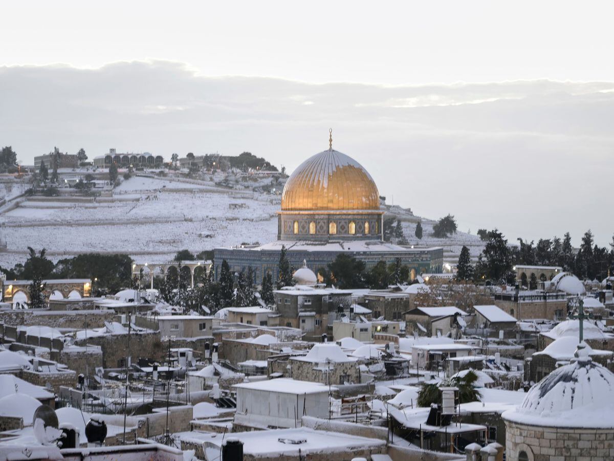 Snow covers the Dome of the Rock Mosque in the Al Aqsa Mosque compound in Jerusalem Old city (Mahmoud Ilean/AP)