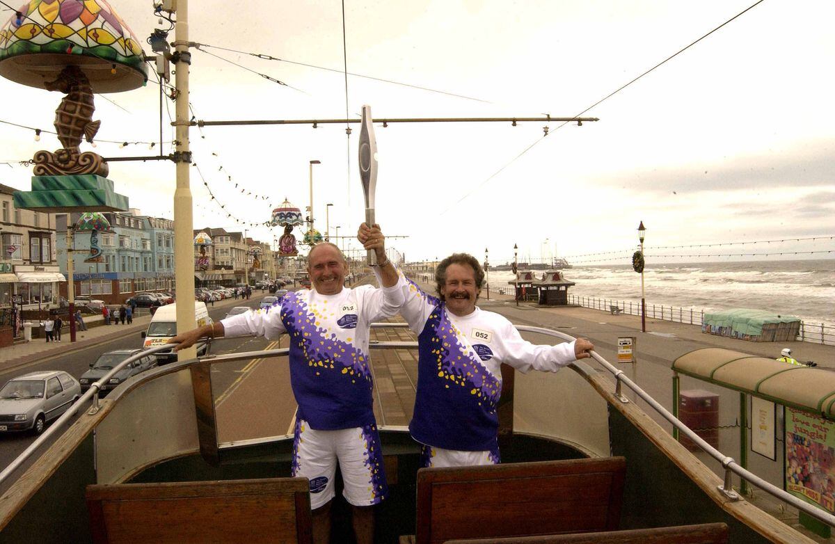 Tuesday 23 July 2002 - The Queen's Jubilee Baton Relay continues it's 137 day journey through the Commonwealth before arriving on July 25th 2002 at the opening ceremony for the Manchester 2002 Commonweath Games. Comics Cannon and Ball carry the Baton aboard a tram at Blackpool (PA photo/GREG GARAY)