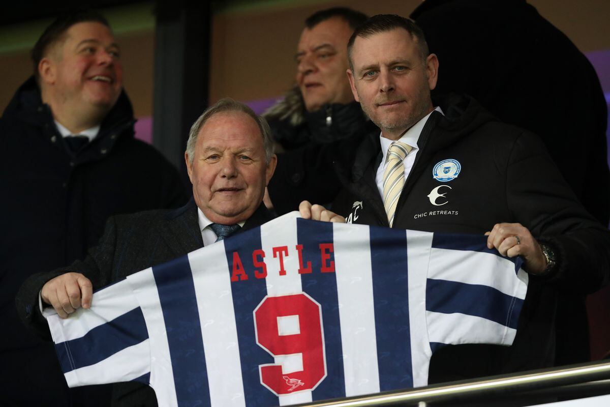 Peterborough United director Barry Fry holds up a Jeff Astle match shirt. Photo: Adam Fradgley via Getty Images