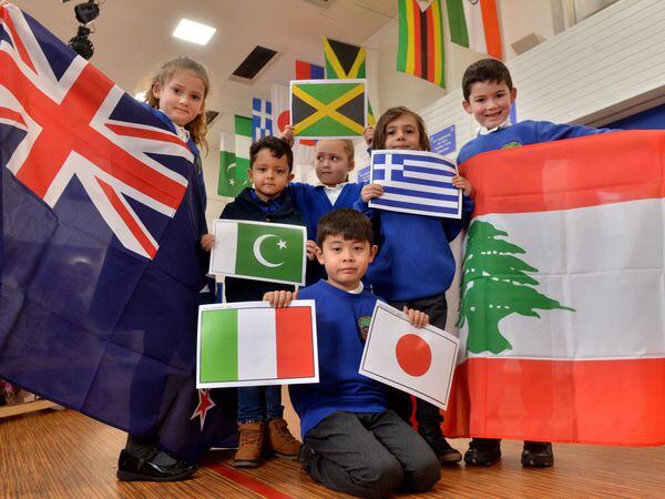 With new flags to go up, on left is Ella Flood, six, Daniel Jaafar, six, and with them is Luca Pauletto Ando, seven, Karim Hussain, four, Hattie Logan, seven, and Marios Foufoulas, five