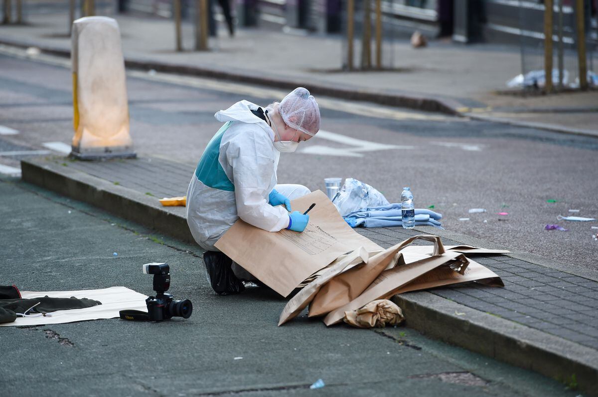 Evidence is put into bags on Hurst Street. Photo: SnapperSK
