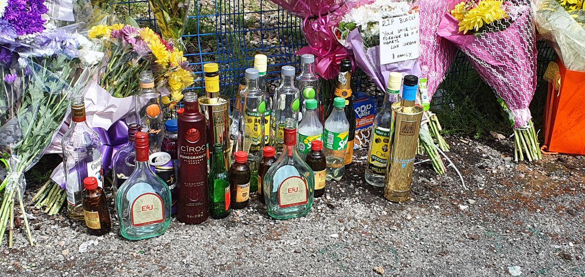 An assortment of different alcoholic and non-alcoholic drinks were left alongside smoke bombs and flares