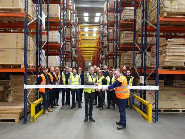 The cutting of the ribbon at the new warehouse