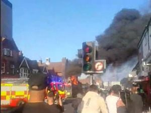 Plumes of smoke rising from the bus. Photo: West Midlands Fire Service.