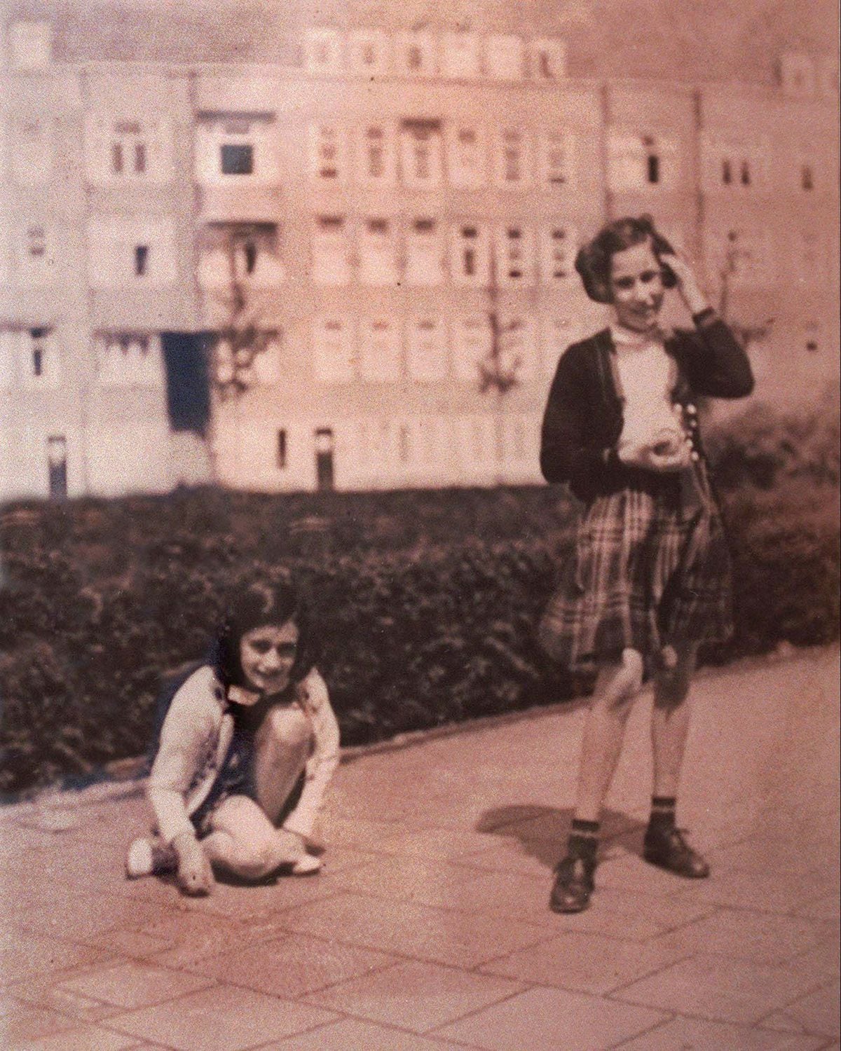 Anne Frank and childhood friend Hannah Goslar Pick, right, are seen in this undated photo from pre-World War Two in Amsterdam during a game of hopscotch