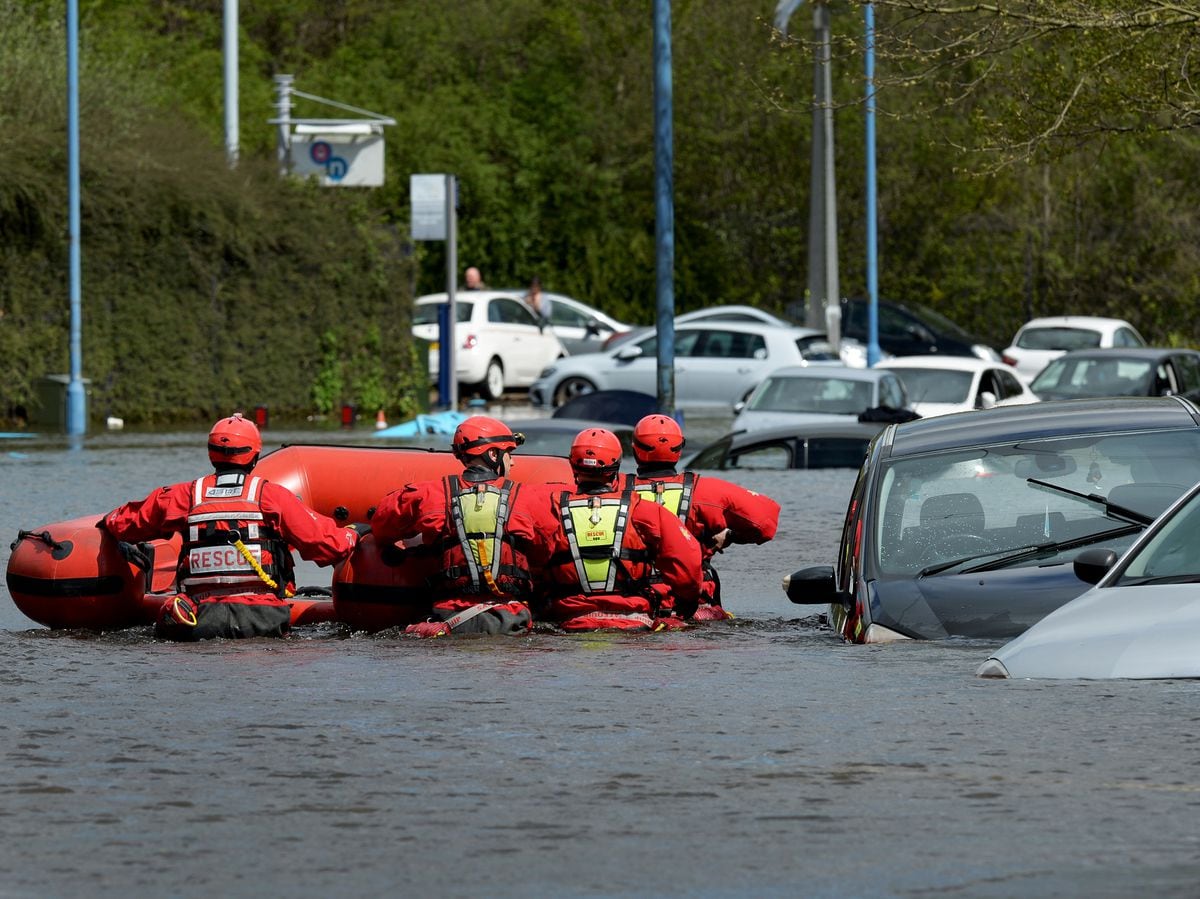 Water rescue teams up to their waists in flooding in Wednesbury