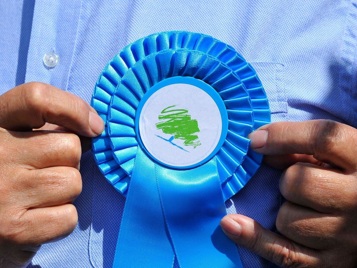 A Conservative Party blue rosette