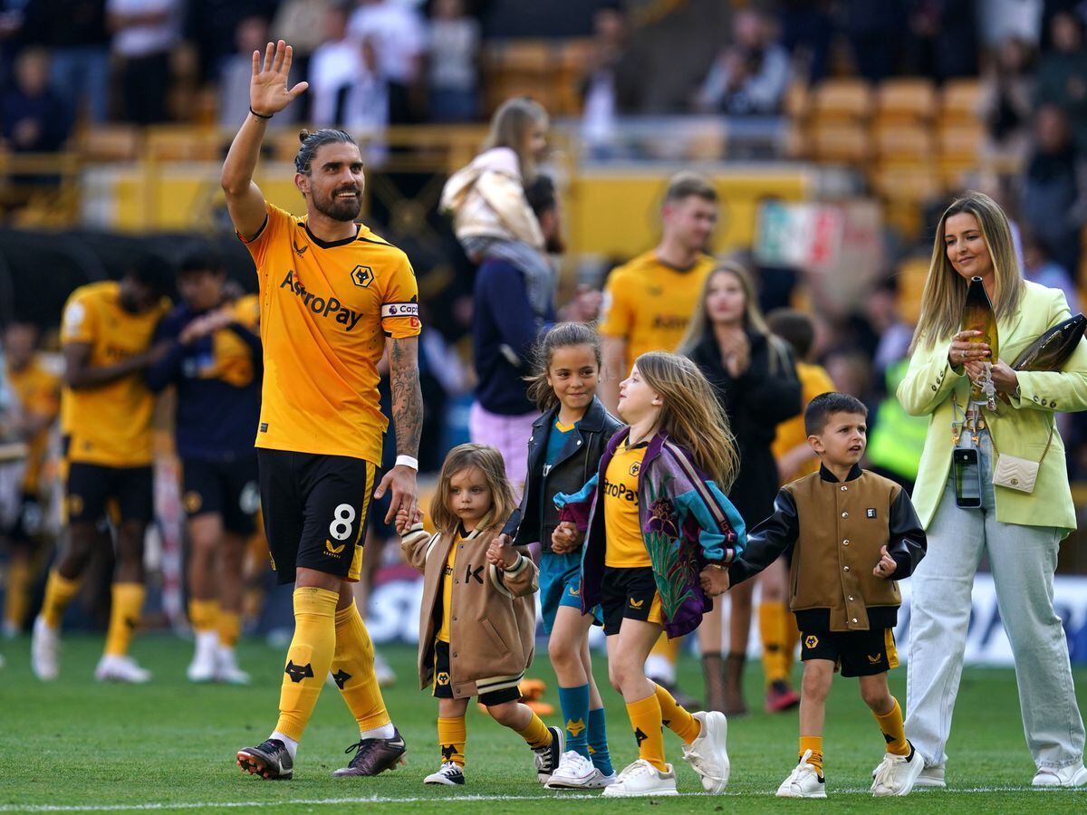 Wolverhampton Wanderers' Ruben Neves walks the pitch with his family at Molineux
