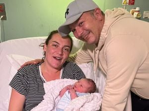 New parents Stacey Arrowsmith and Aaron Child with baby Arlo, who played an instrumental part in Aaron's proposal