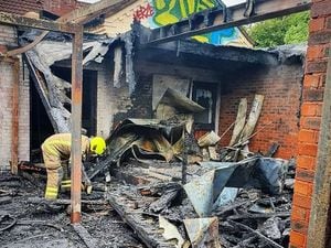 Fire crews inspect the scene after the fire. Photo: West Midlands Fire Service
