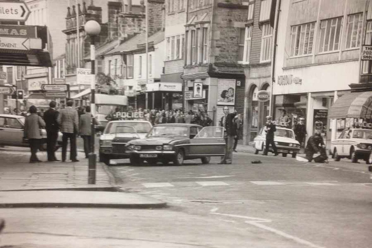 Police in Spring Gardens, Buxton, after officers arrested Street - who was driving the car to the front of the image.