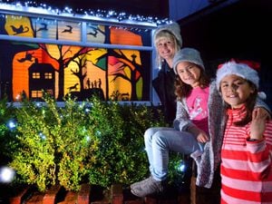 Roseanne Tang and daughters Sophie, six, and Grace, nine, with their display for the Bearwood Winter Wonderland trail