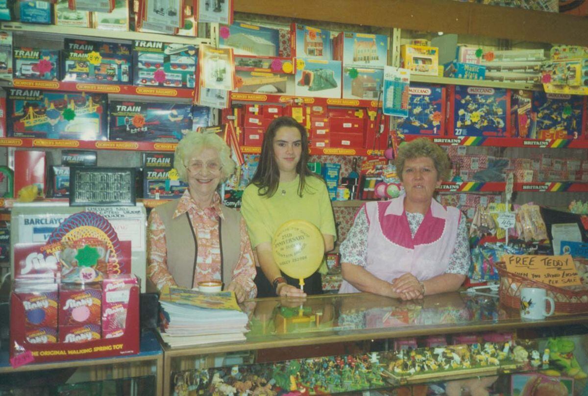 Alan's mother, Evelyn Caswell, left, working at the Arcade toy store in 1983