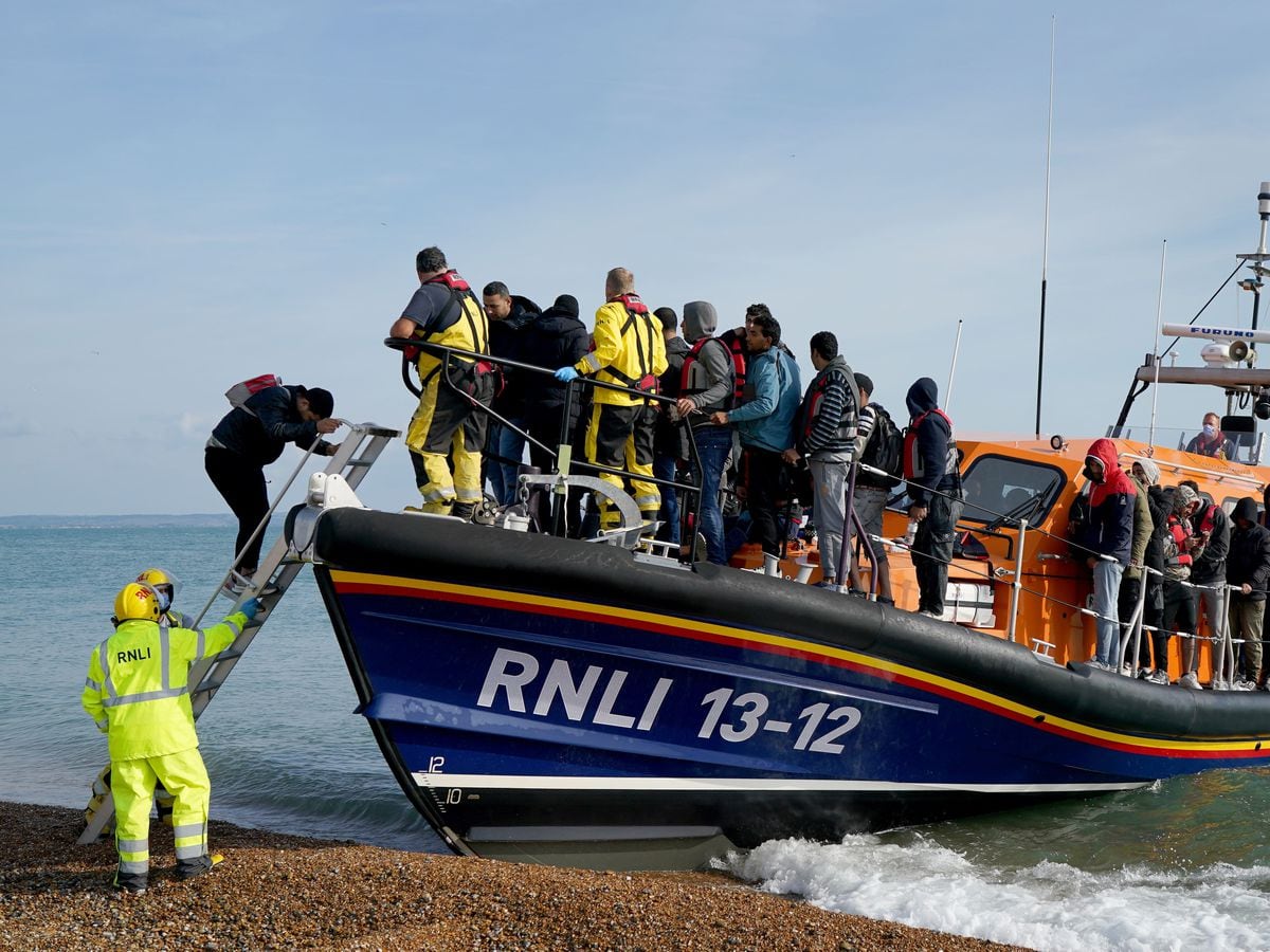 A group of people thought to be migrants arrive in Dungeness, Kent on Thursday September 22 (Gareth Fuller/PA)