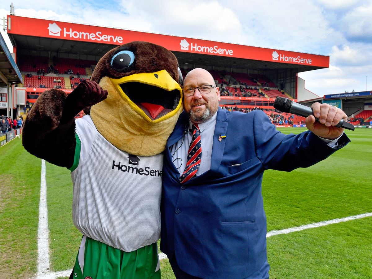 Walsall FC match announcer Gavin Drake, pictured with Swifty the mascot before the match against Port Vale. 