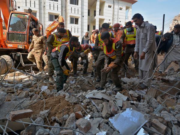 Security officials and rescue workers at the scene in Peshawar