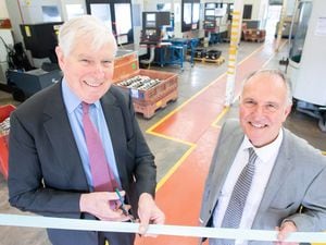 Lord Carrington opens the new machine shop with Tony Sartorius