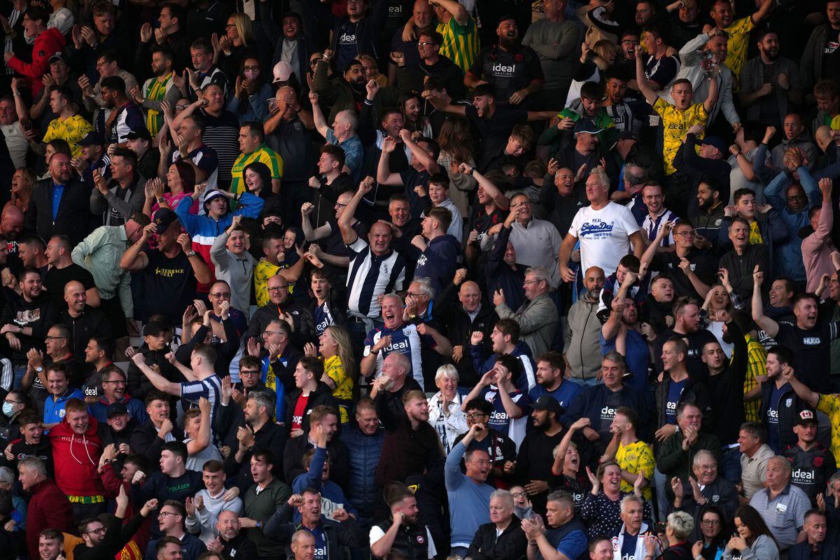 West Bromwich Albion fans in the stands celebrate
