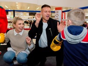 Love Island stars Olivia Buckland and Alex Bowen at Pizzasqr at Inu Merry Hill Shopping Centre in Brierley Hill. The newlyweds were runner-ups in the 2016 reality TV contest. In Picture: Pretending to box with a little boy.