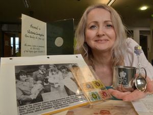 Victoria Brownhill with gifts she was given as she was born on the day of the Silver Jubilee