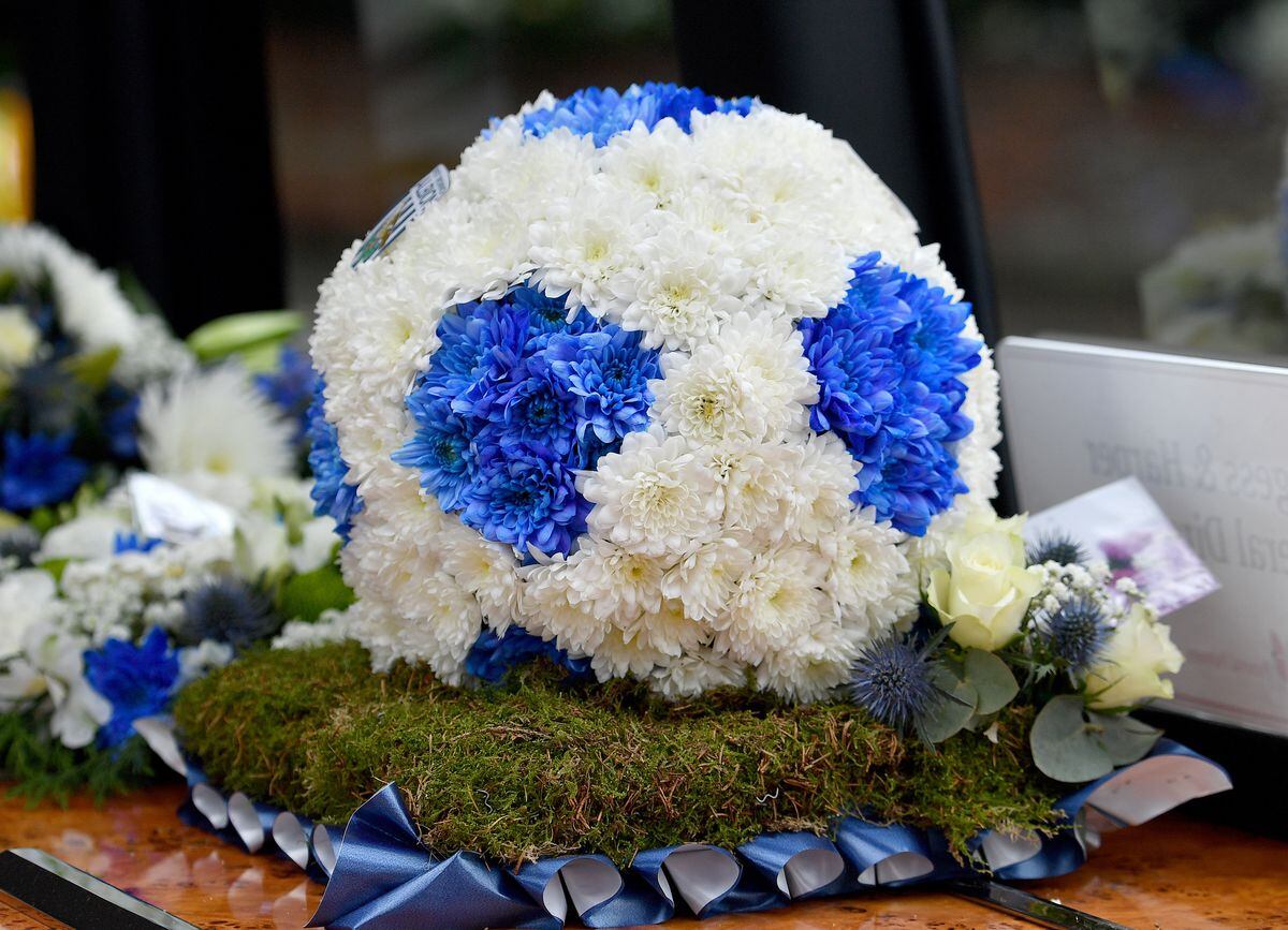 The funeral of sports broadcaster Nigel Pearson at St Benedict's Church, Wombourne..Flowers in the shape of a football in Albion colours