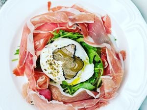 Top quality ingredients – the creamy burrata with Parma ham and rocket, topped with luxurious black truffle shavings