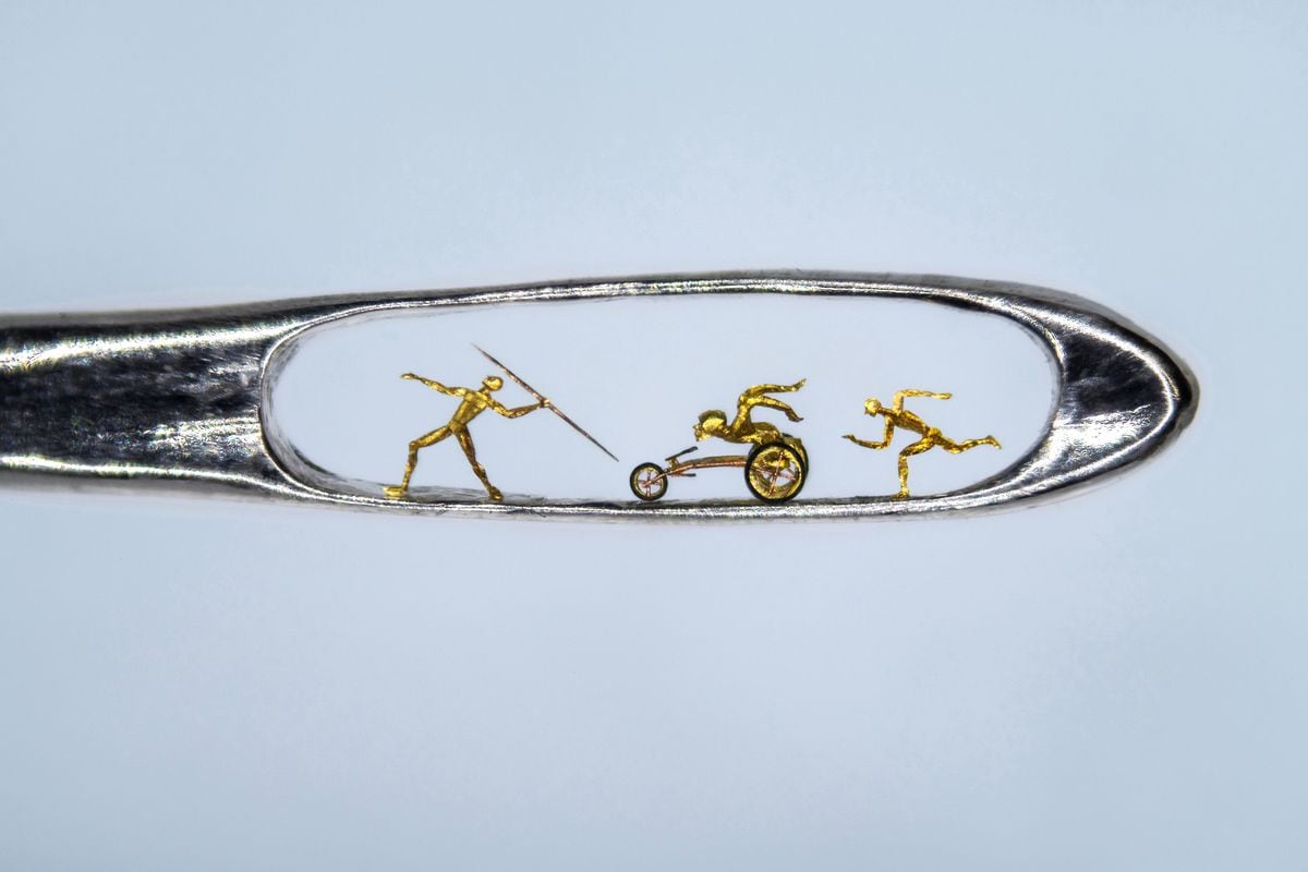 Willard Wigan's Commonwealth Games micro-art showing a runner, javelin thrower and a paralympian athlete in a wheelchair 