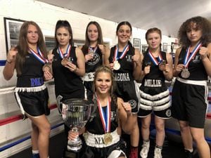 Kesley Oakley (centre) and the Priory Park boxers from the women's Box Cup. L-R Mia Holland, Taylor Spooner, Courtney Dalloway, Gieona Kaja-Cuedajri, Millie Short and Ellie Jones.