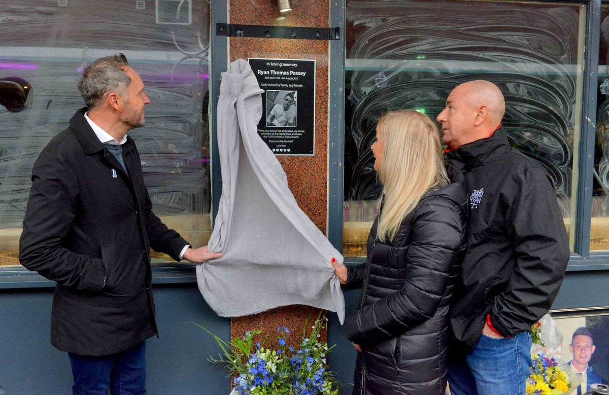 Unveiling the plaque in memory of Ryan Passey are his dad Adrian Passey, mom Gillian Taylor and step-dad Phil Taylor