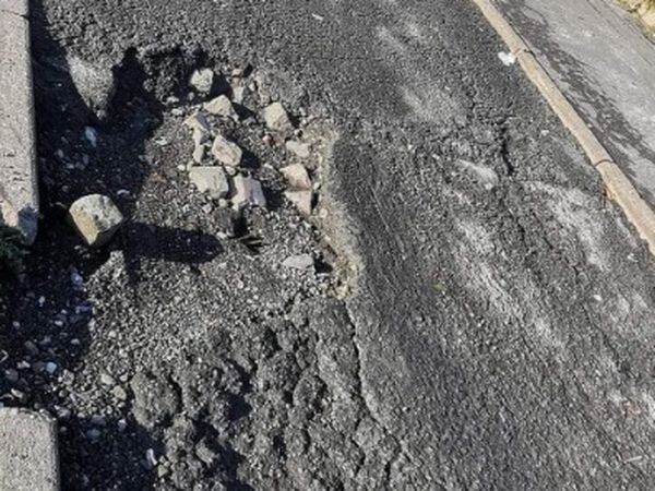 A giant pothole on Manor House Road in Wednesbury. Sandwell councillor David Wilkes is concerned for drivers using the route, claiming the road has been left