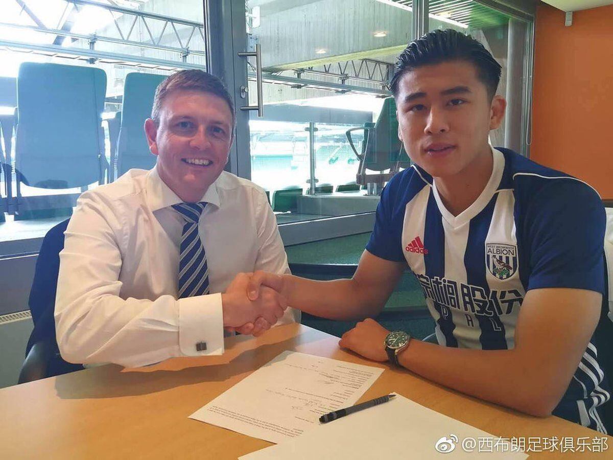 Yuning Zhang, right, with director of football administration Richard Garlick. 