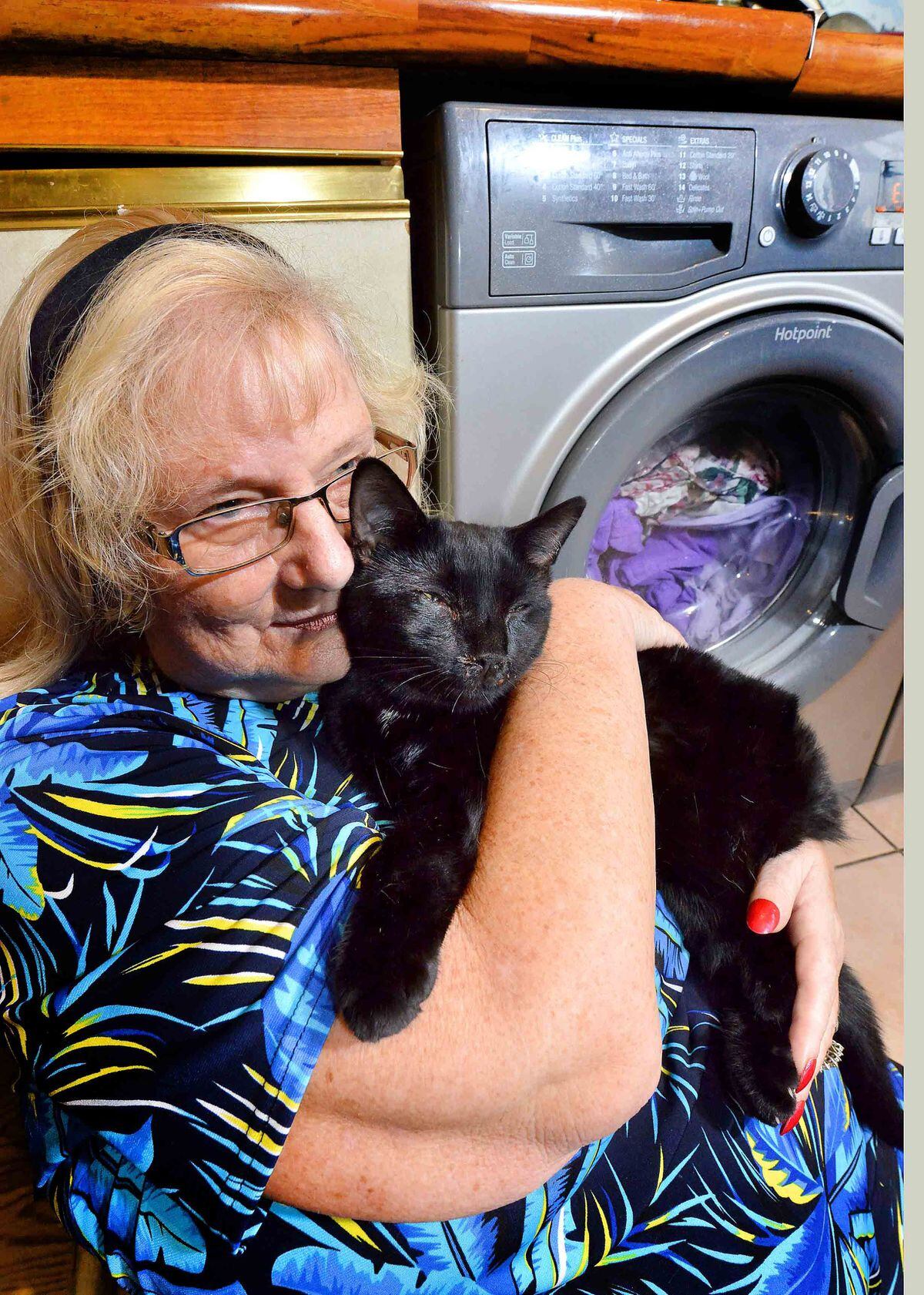 Mrs Sutton, Tiggy, and the washing machine