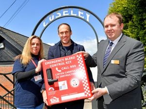 Councillor Kieran Casey, Kelly Addiss (supporter of the Daniel Baird Foundation) and Andrew McGill from West Midlands Trains pose with the new bleed kit, which is to be installed at Coseley train station.
