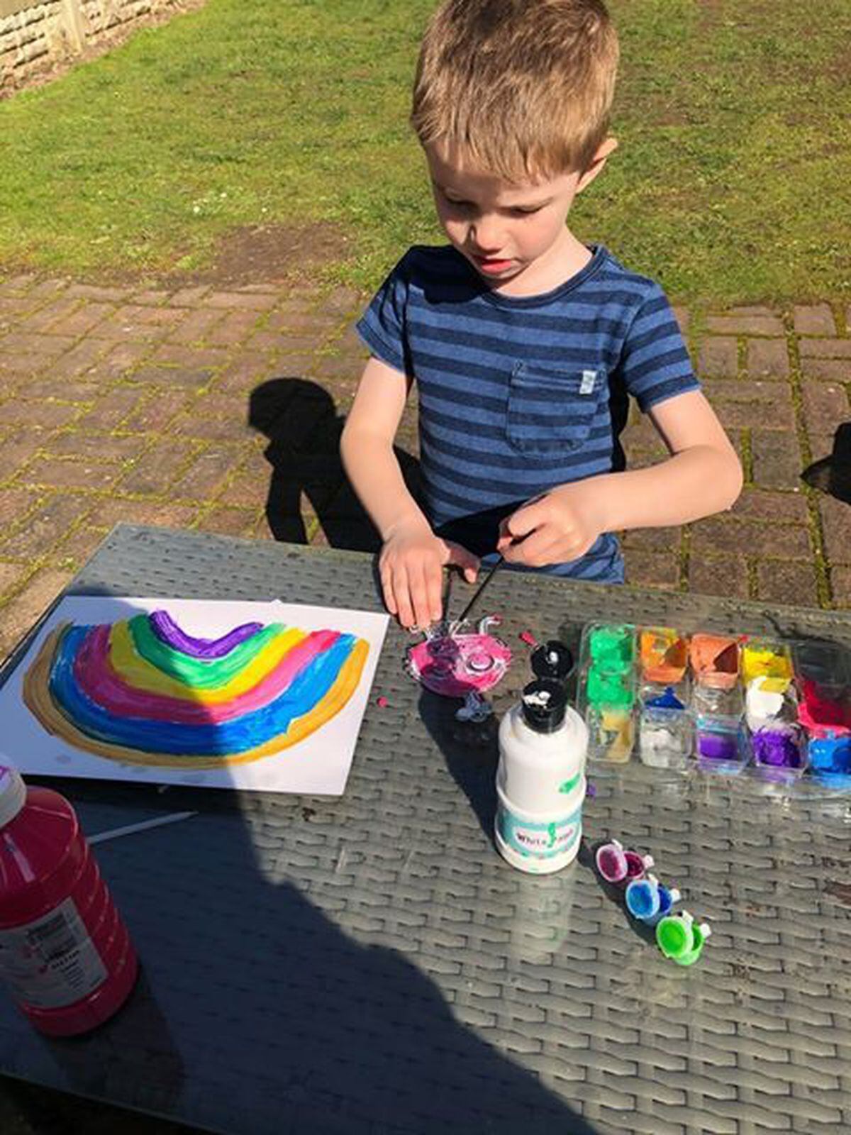 William Tomlinson, 5, from Tettenhall, painting his rainbow