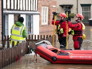Rescue teams check on residents in Bewdley where water from the River Severn has flooded the town