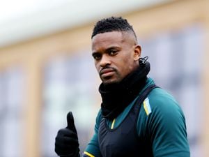Nelson Semedo of Wolverhampton Wanderers walks out to the pitch ahead of a Wolverhampton Wanderers Training Session at The Sir Jack Hayward Training Ground on January 21, 2022 in Wolverhampton, England. (Photo by Jack Thomas - WWFC/Wolves via Getty Images).