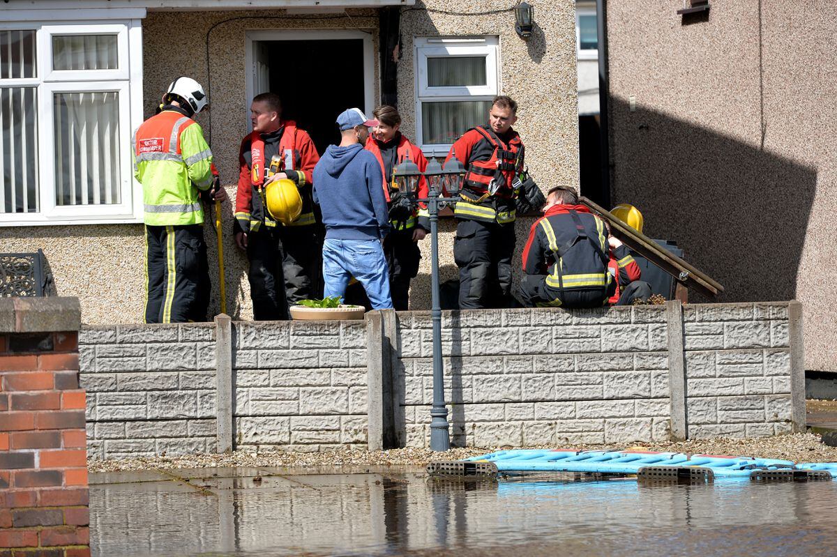 Emergency services at Leabrook Road North after a water main burst. Pictures: Tim Sturgess