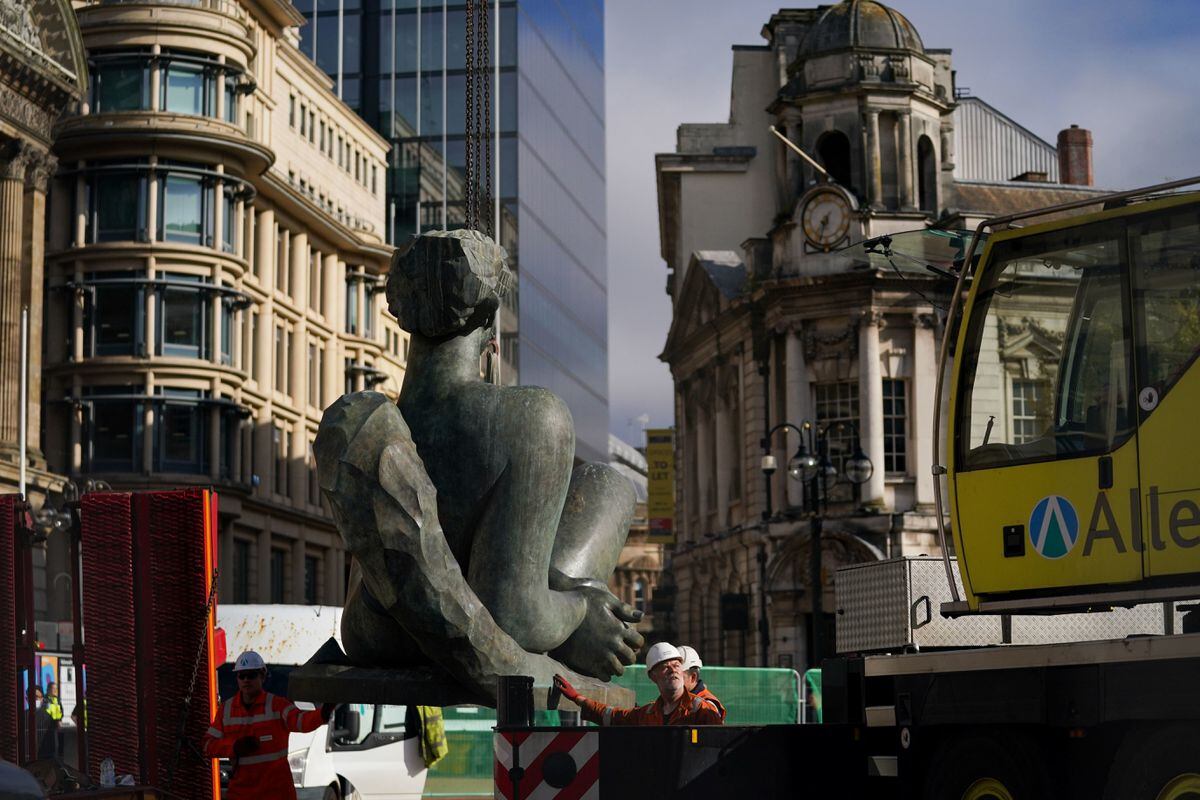 The 'Floozie in the Jacuzzi' is lifted out of its fountain in Victoria Square